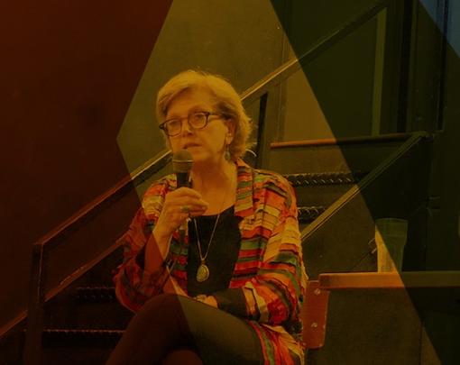 Marjorie Kelly and Ted Howard speaking at Busboys and Poets.